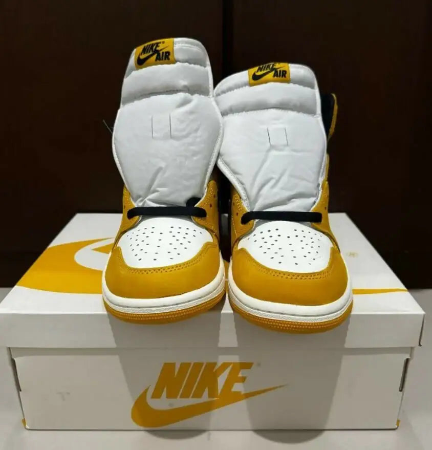 Yellow and white Nike Air Jordan 1 High Ochre sneakers with black laces, fast shipping