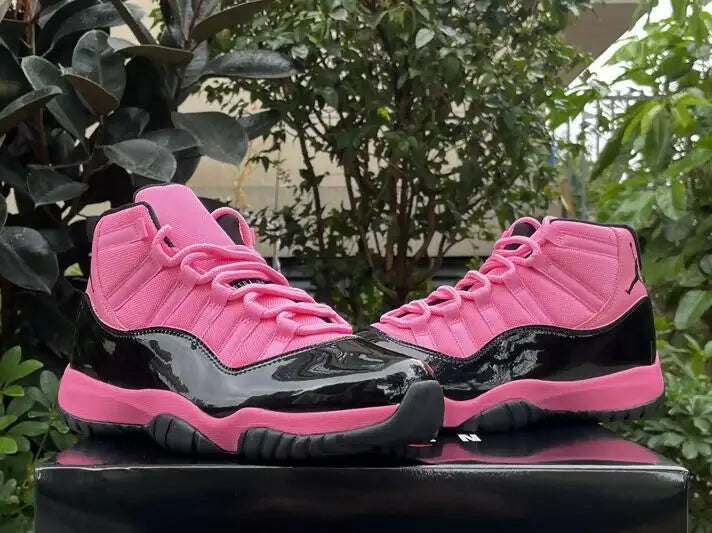 Pink and black Air Jordan 11 sneakers available with fast shipping within business days