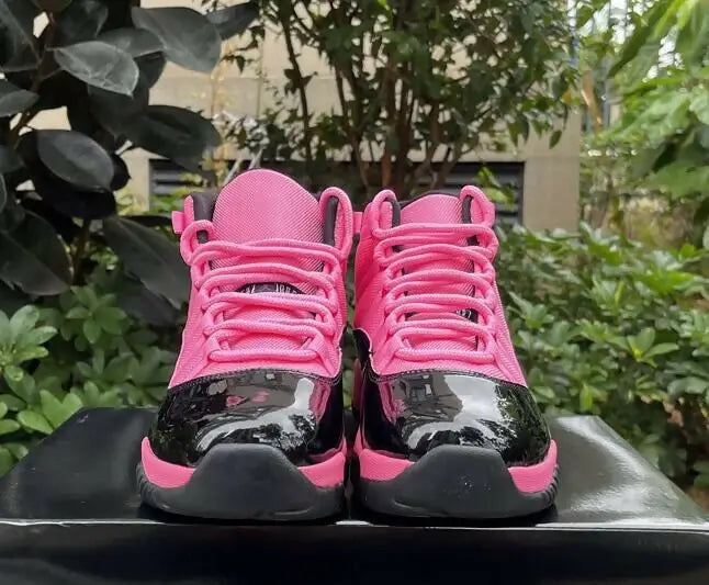 Air Jordan 11 Black Pink high-top sneakers with patent leather accents, fast shipping available