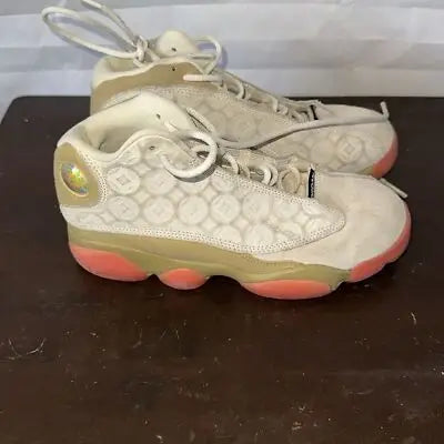 Air Jordan 13 Retro Chinese New Year beige and coral sneakers with textured patterned upper