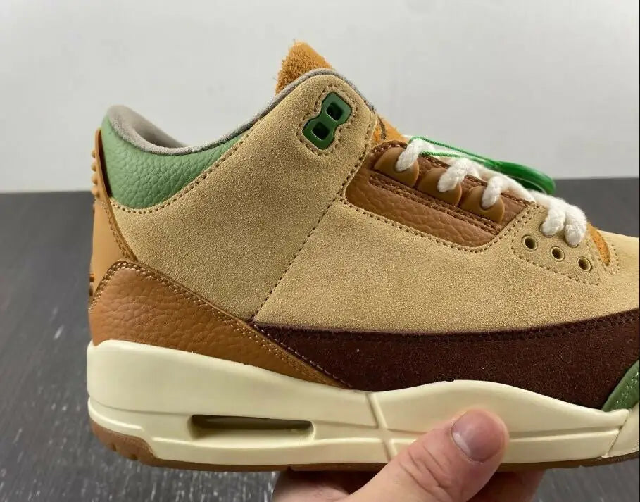 Air Jordan 3 Zion Williamson Voodoo sneaker in tan suede and brown leather with green accents and white laces, available with fast shipping within business days depending on location