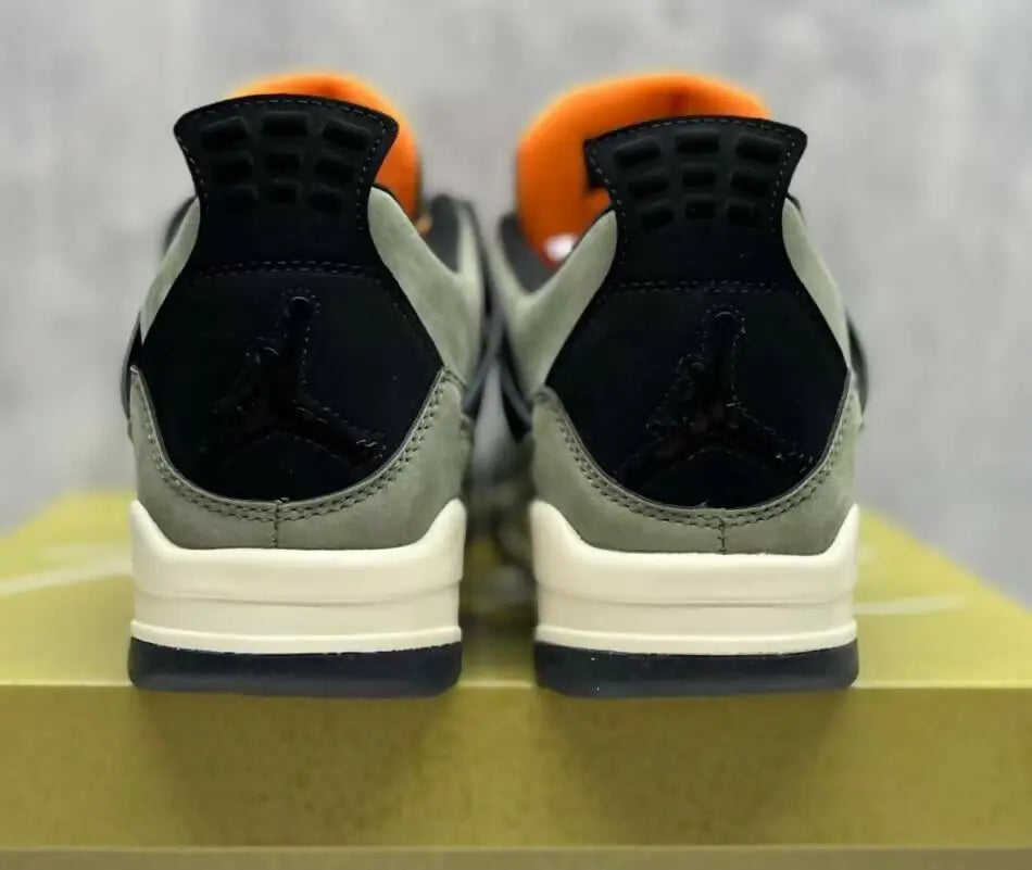 Olive green and black Air Jordan 4 Undefeated sneakers with orange lining, fast shipping available