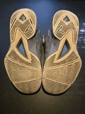 Air Jordan basketball shoes in cool grey and tan with herringbone traction pattern