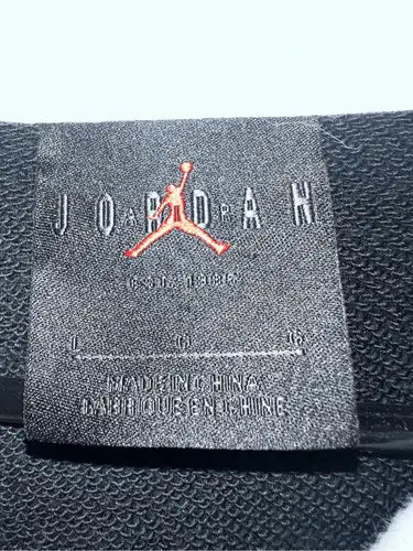 Black Jordan brand tag with Jumpman logo on Air Jordan Retro Jump Man Hoodie