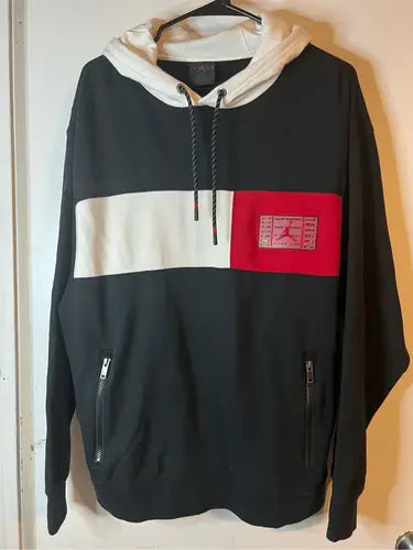 Black Air Jordan Retro Jump Man hoodie with white and red color block on chest