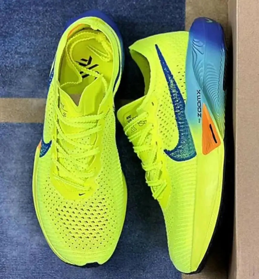 Vibrant neon yellow Air Zoom Alphafly Next Vaporfly 3 Green Volt running shoes with blue and orange accents, fast shipping available
