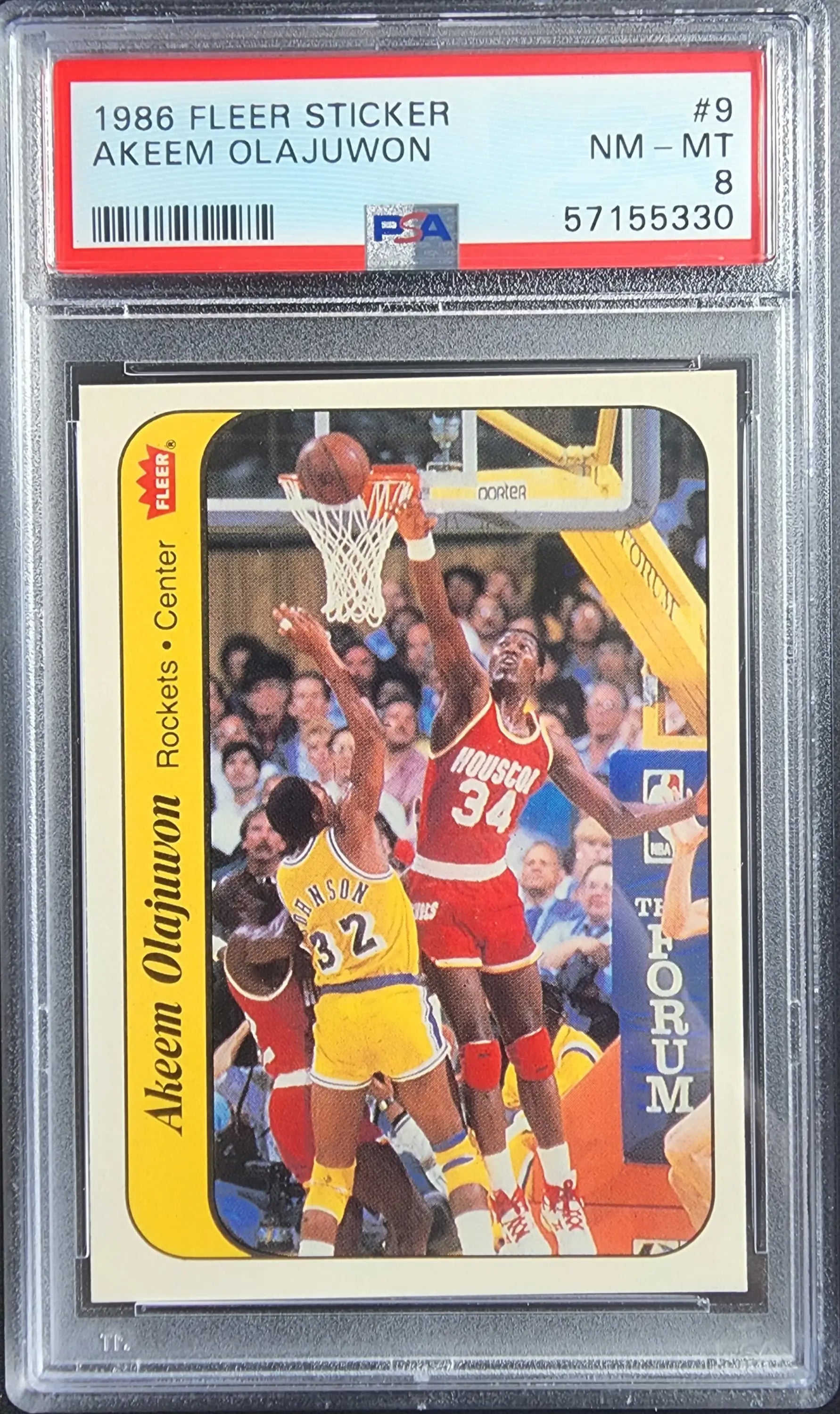 Akeem Olajuwon 1986 Fleer Stickers #8 PSA 8 Nm-Mint card featuring player in red jersey