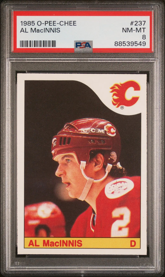PSA-graded 1985 O-Pee-Chee Calgary Flames trading card of Al MacInnis in red jersey