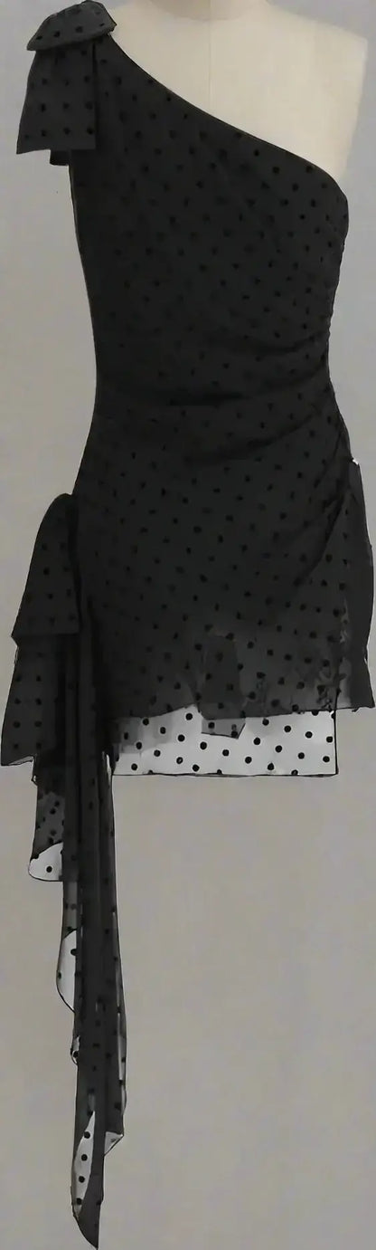 Alessandra Rich black one-shoulder dress with polka dots, ruffled accents, and flowing sash