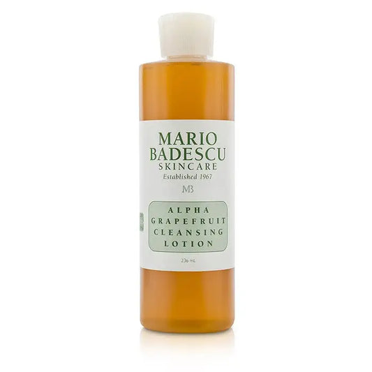 Orange liquid cleanser in a clear plastic bottle with white cap for Alpha Grapefruit Cleansing Lotion