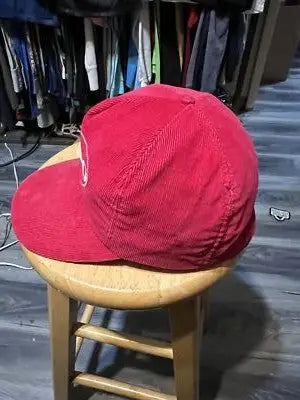 Alpo Red Corduroy Snapback Hat featuring a stylish red corduroy snapback design