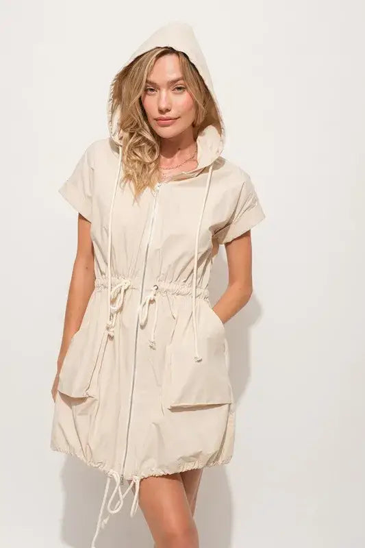 Women’s beige short sleeve string details hooded mini dress with front zipper and large pockets
