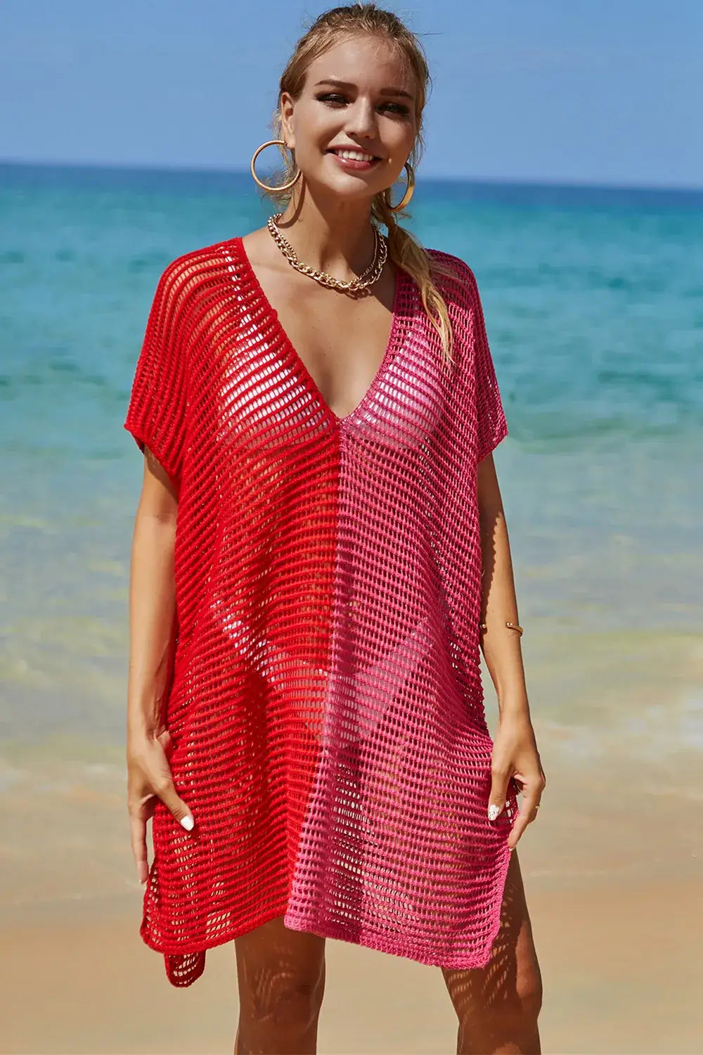 Two-tone red and pink knit beach cover-up with V-neck featuring angel wings openwork design