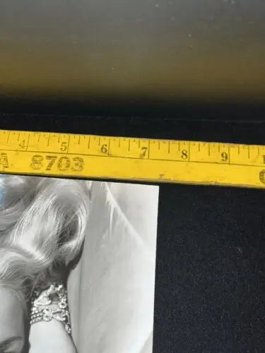 Yellow measuring tape featured in Angela Greene John F. Kennedy signed photo collectibles