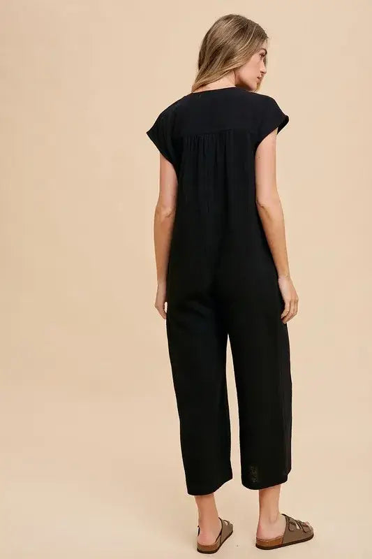 Black linen wide leg jumpsuit with cap sleeves and cropped pants for casual wear