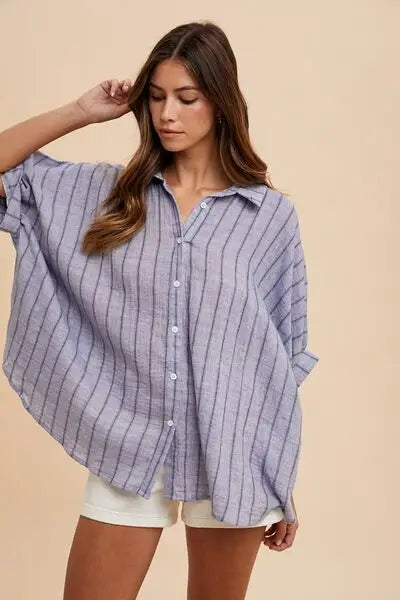 Woman wearing Annie Wear striped half sleeve shirt in light blue and black