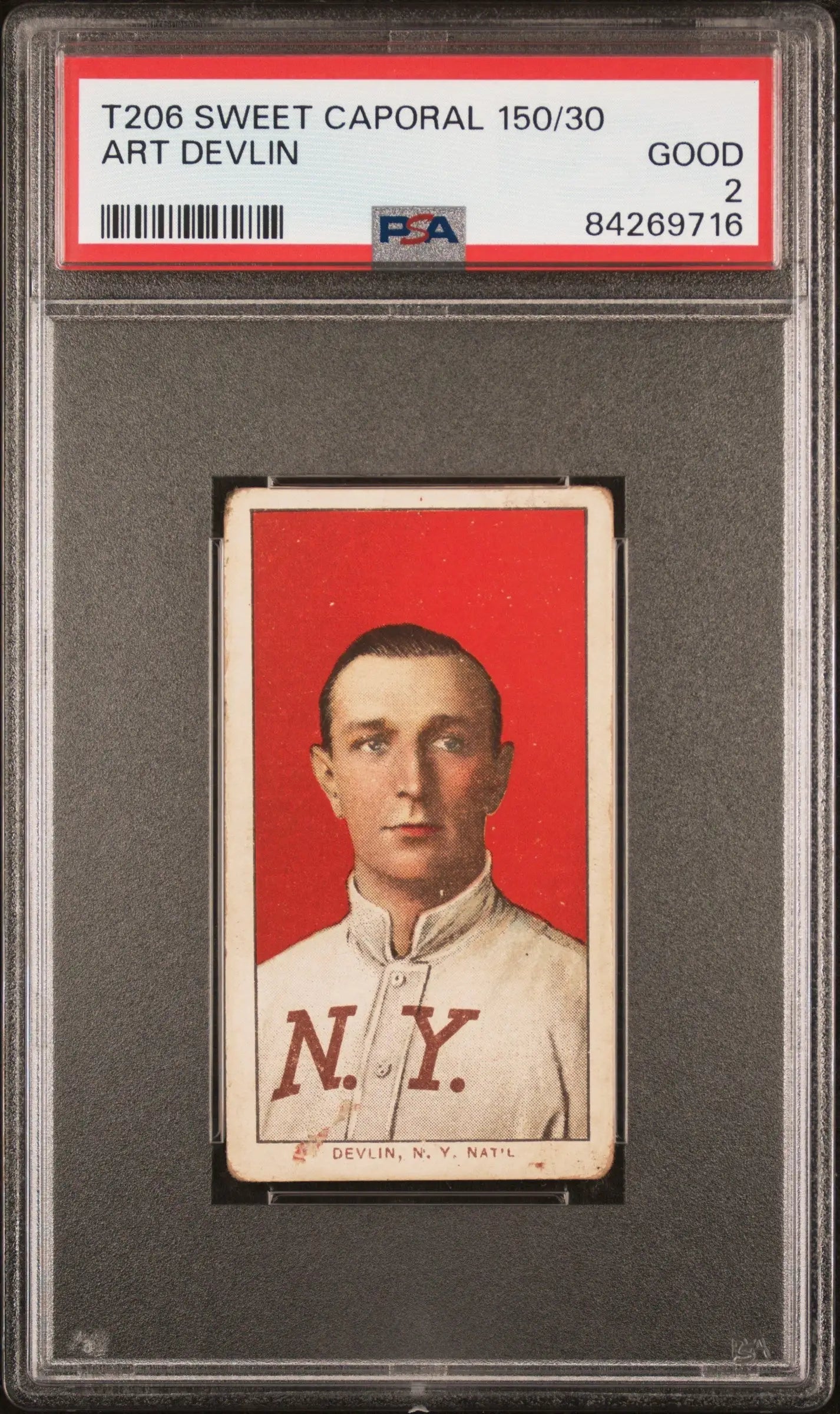 PSA-graded T206 Sweet Caporal featuring Art Devlin in white NY uniform on red background