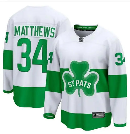 White and green Auston Matthews Toronto Maple Leafs C Premier Breakaway jersey with shamrock logo