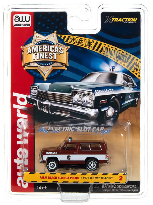 Packaged toy car model of a vintage police vehicle from Auto World Xtraction Americas