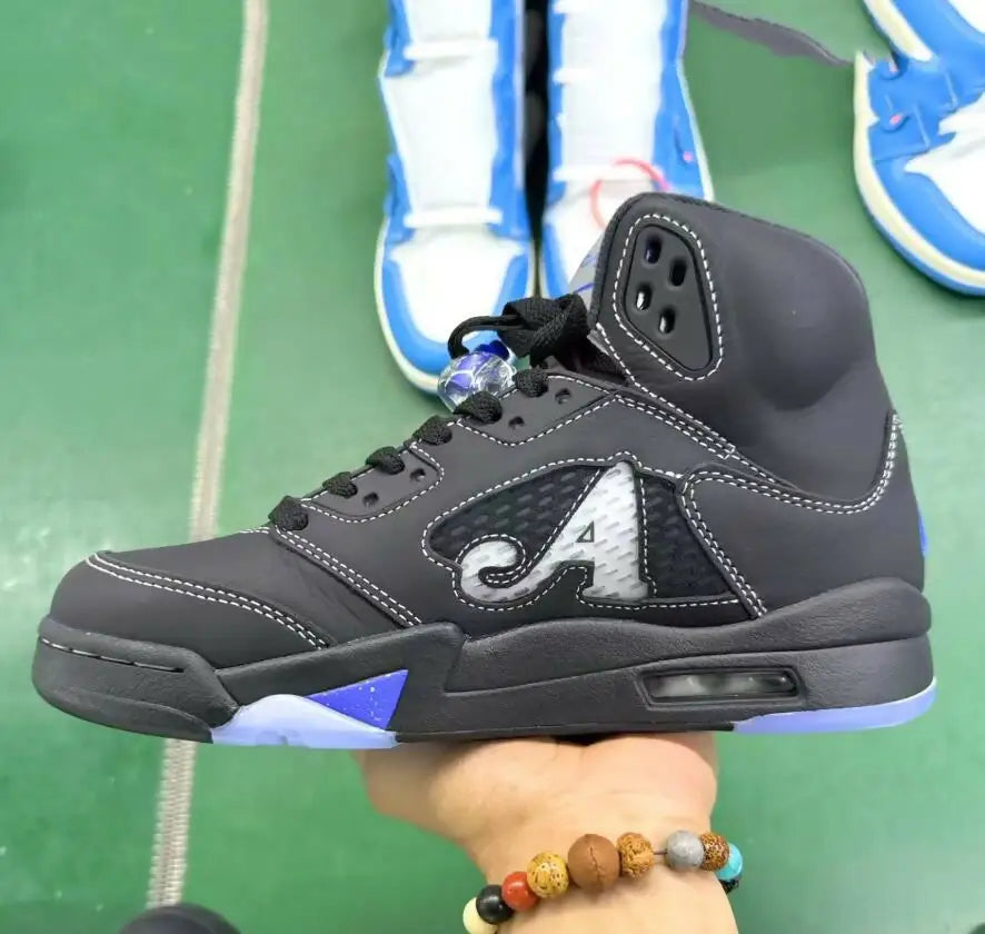 Black high-top sneaker with white A logo, blue accents, fast shipping, business days depending