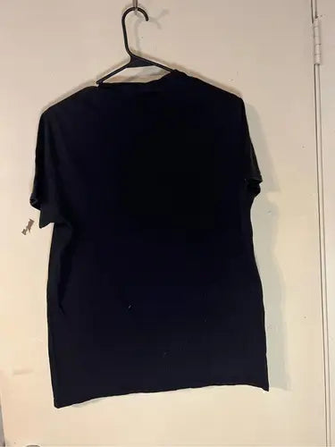 Black short-sleeved Baby Yoda Star Wars T-shirt on a hanger for kids