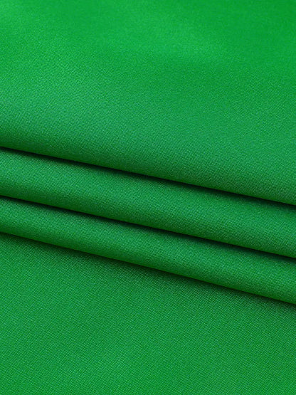Vibrant green backless maxi dress with subtle diagonal weave perfect for elegant occasions