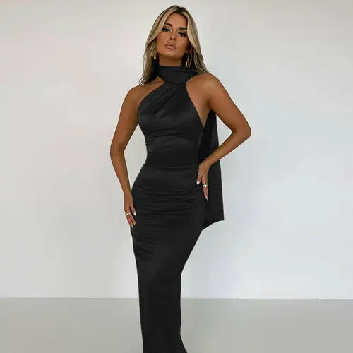 Black backless maxi dress with twisted neckline and draped side detail for elegant occasions