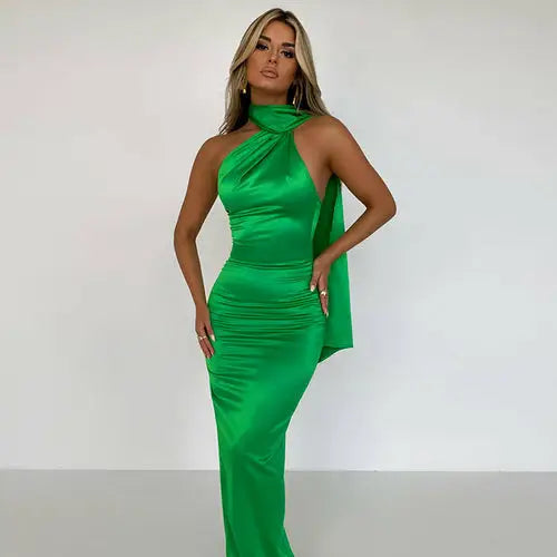 Elegant emerald green satin backless maxi dress with halter neck and draped detail
