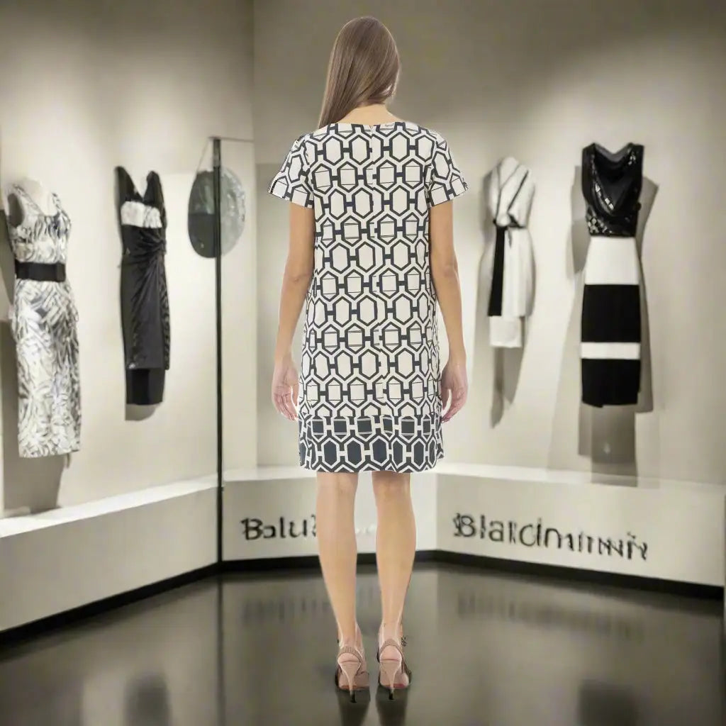 Woman modeling Baldinini Trend black and white graphic print dress with geometric pattern