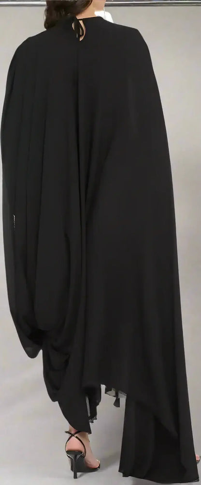 Balenciaga Black crepe dress with asymmetric hem, flowing cape, tassels, and high heels