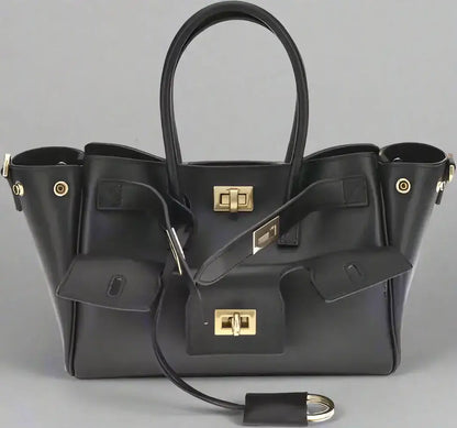 Black leather Bel Air mini handbag with gold-tone hardware and buckle closures