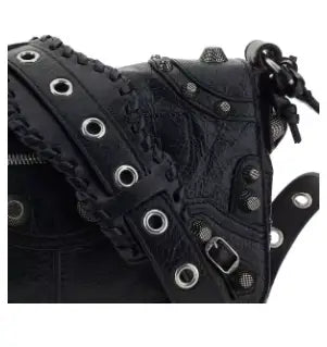 Black leather studded Cagole shoulder bag with braided grommeted straps from BALENCIAGA