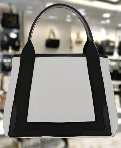 Balenciaga cotton tote bag with black leather trim and shoulder strap