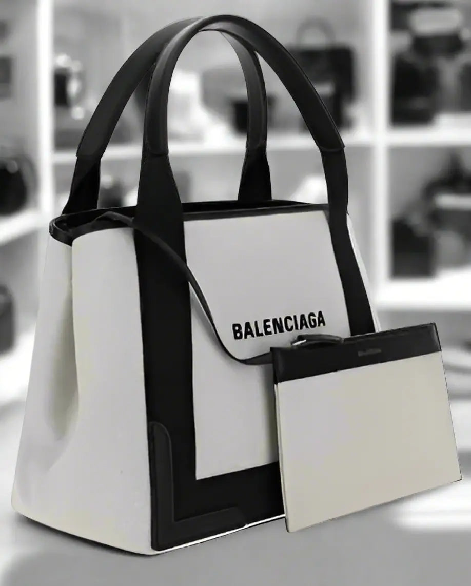 White tote bag with black trim, detachable pouch, shoulder strap, Balenciaga cotton handbag