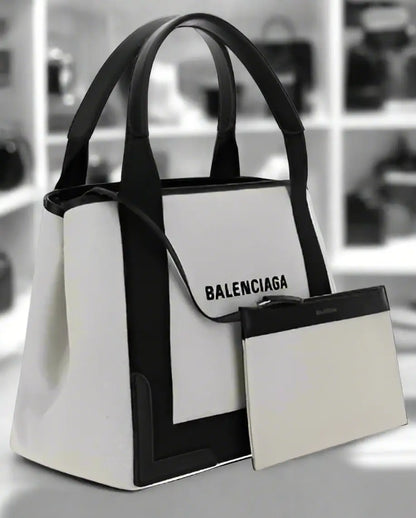 White tote bag with black trim, detachable pouch, shoulder strap, Balenciaga cotton handbag