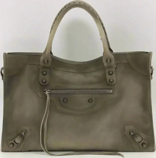 Grey patent leather tote bag with braided handles, studs, and front zipper pocket for city medium handbag style