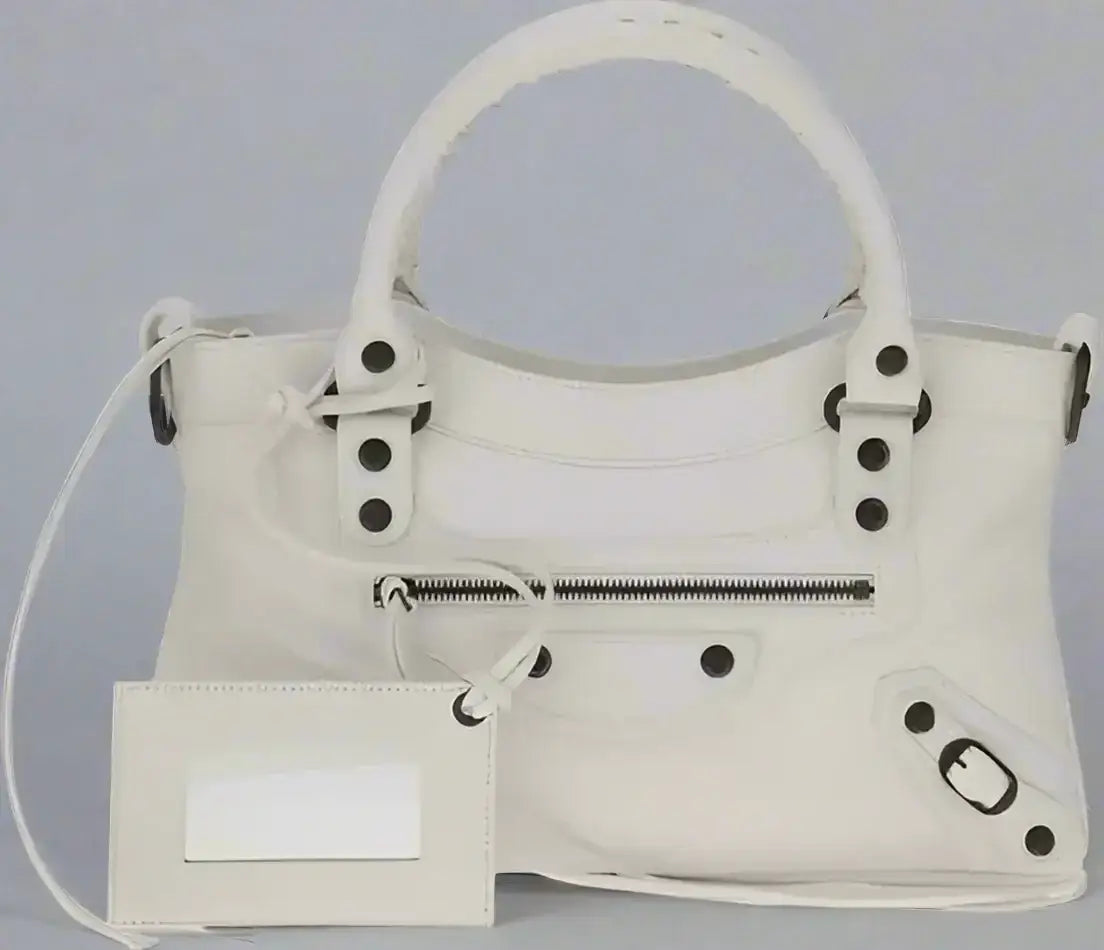 Balenciaga women’s white leather Le City First Handbag with dark hardware and zippered pocket