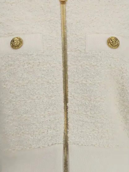 White bouclé tweed bomber jacket with gold zipper and decorative gold buttons