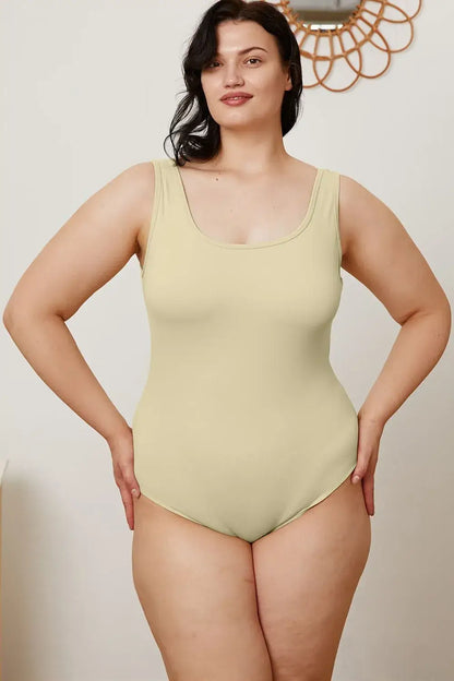 Light green full-body leotard in Basic Bae Square Neck Sleeveless Bodysuit, perfect for jeans size