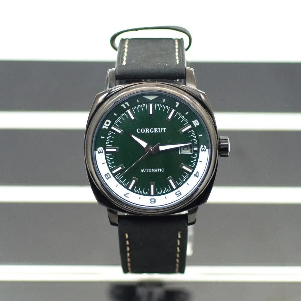 Men’s automatic watch with dark green dial and black leather strap on steel black surface