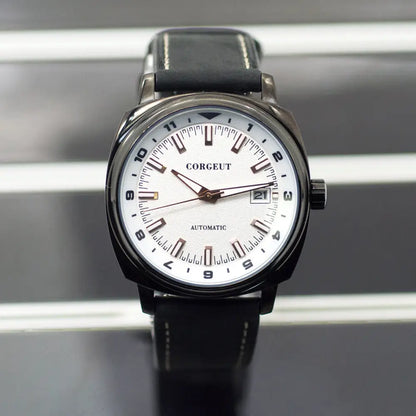 Men’s black leather strap watch with steel black surface, white face, and date display