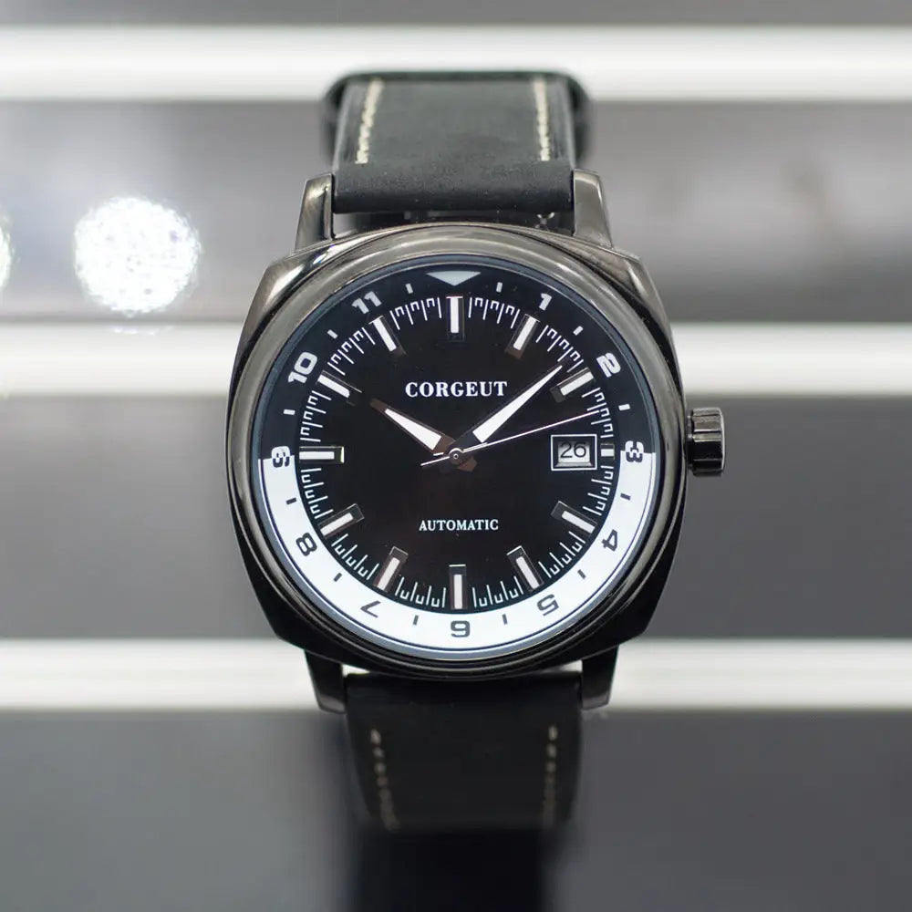 Black and silver automatic men’s watch with steel black surface and leather strap