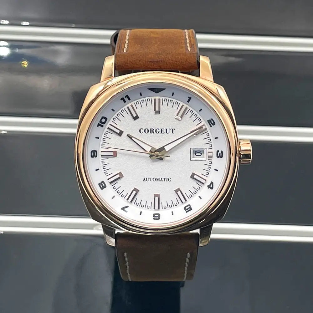 Rose gold-toned men’s watch with white dial, brown leather strap on steel black surface