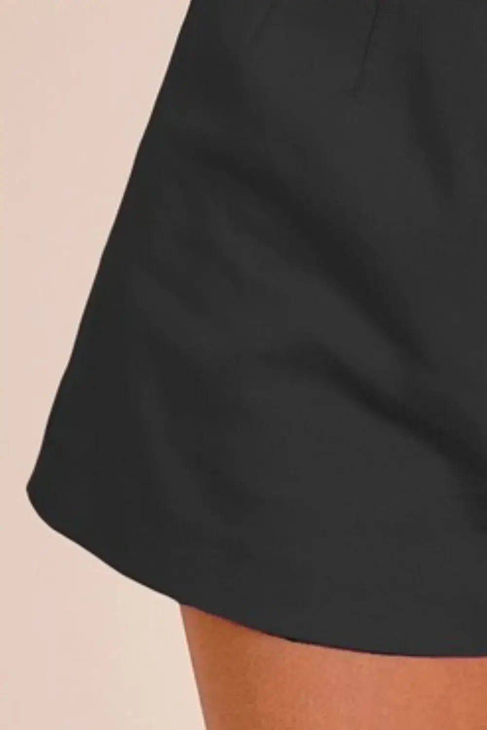 Black cotton bandless tailored shorts with elastic waistband and side pockets