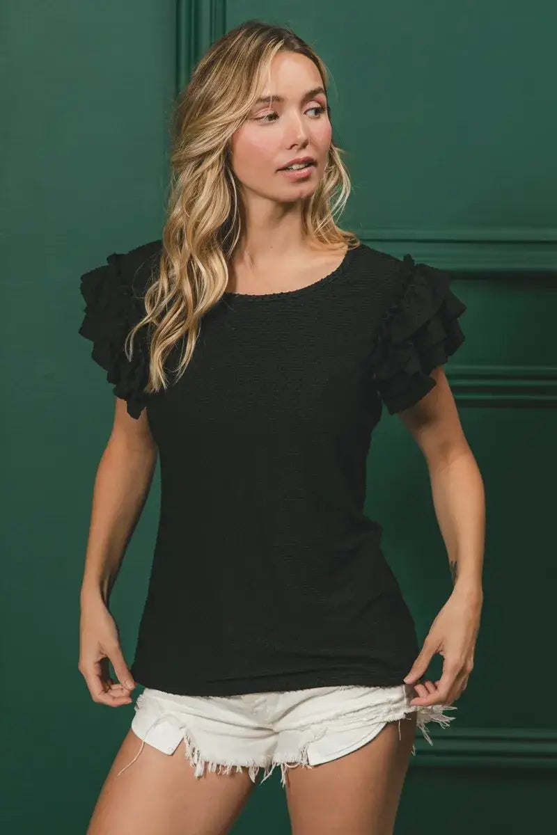 Black birdseye texture layered ruffle top with short sleeves and frill hem for summer style