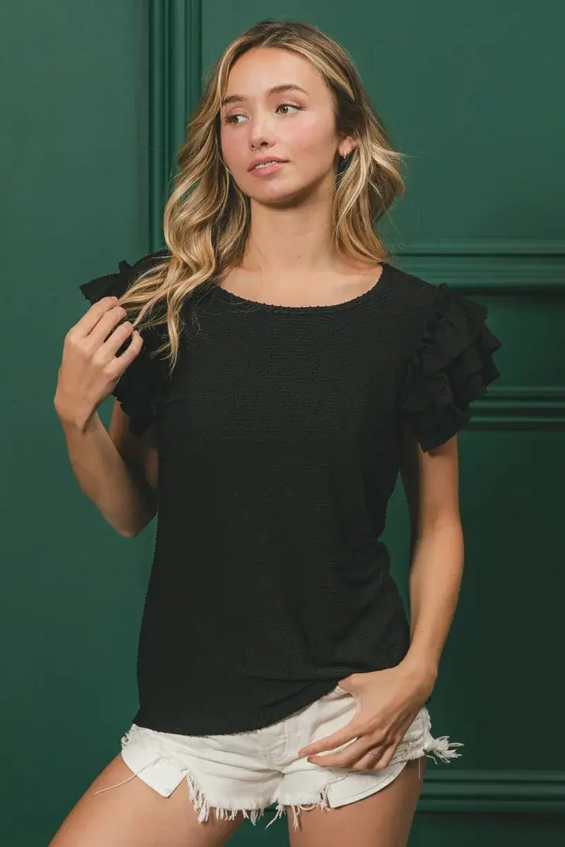 Black birdseye texture layered ruffle top with frill shoulder detail