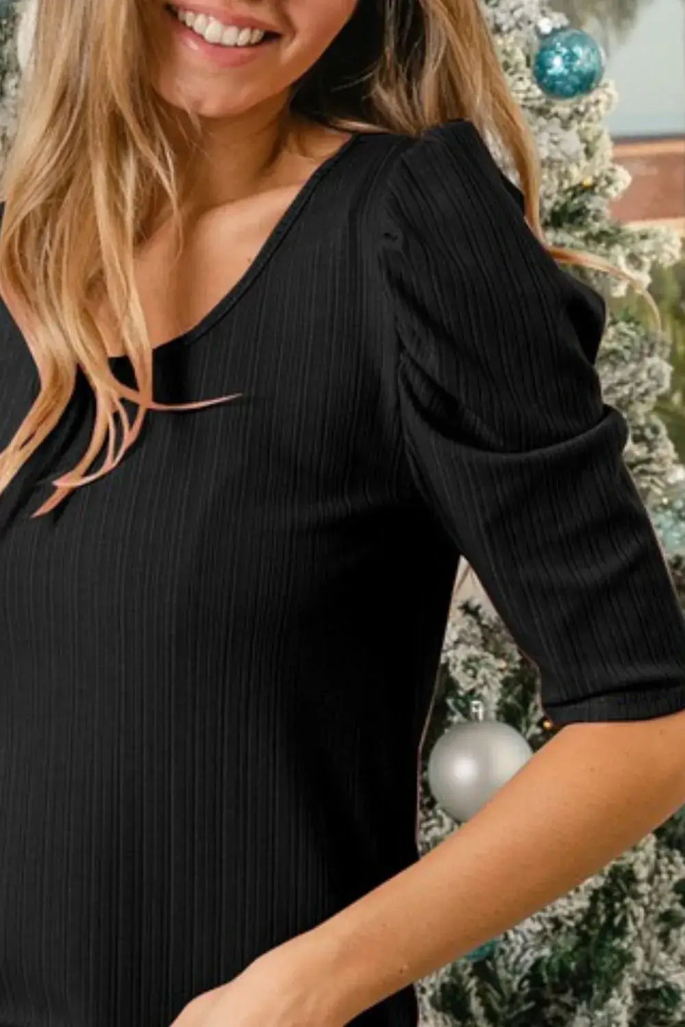 Black rib knit dress with puff sleeves and v-neckline from BiBi Verigated Rib Knit Puff collection