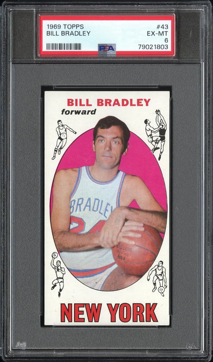 PSA-graded vintage trading card of Bill Bradley in a white Knicks jersey against pink background