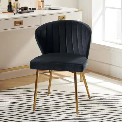 Navy blue velvet wingback accent chair with gold metal legs and channel tufting design