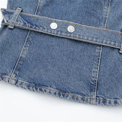 Blue denim corset top with stitched seam and silver buttons showcasing denim style
